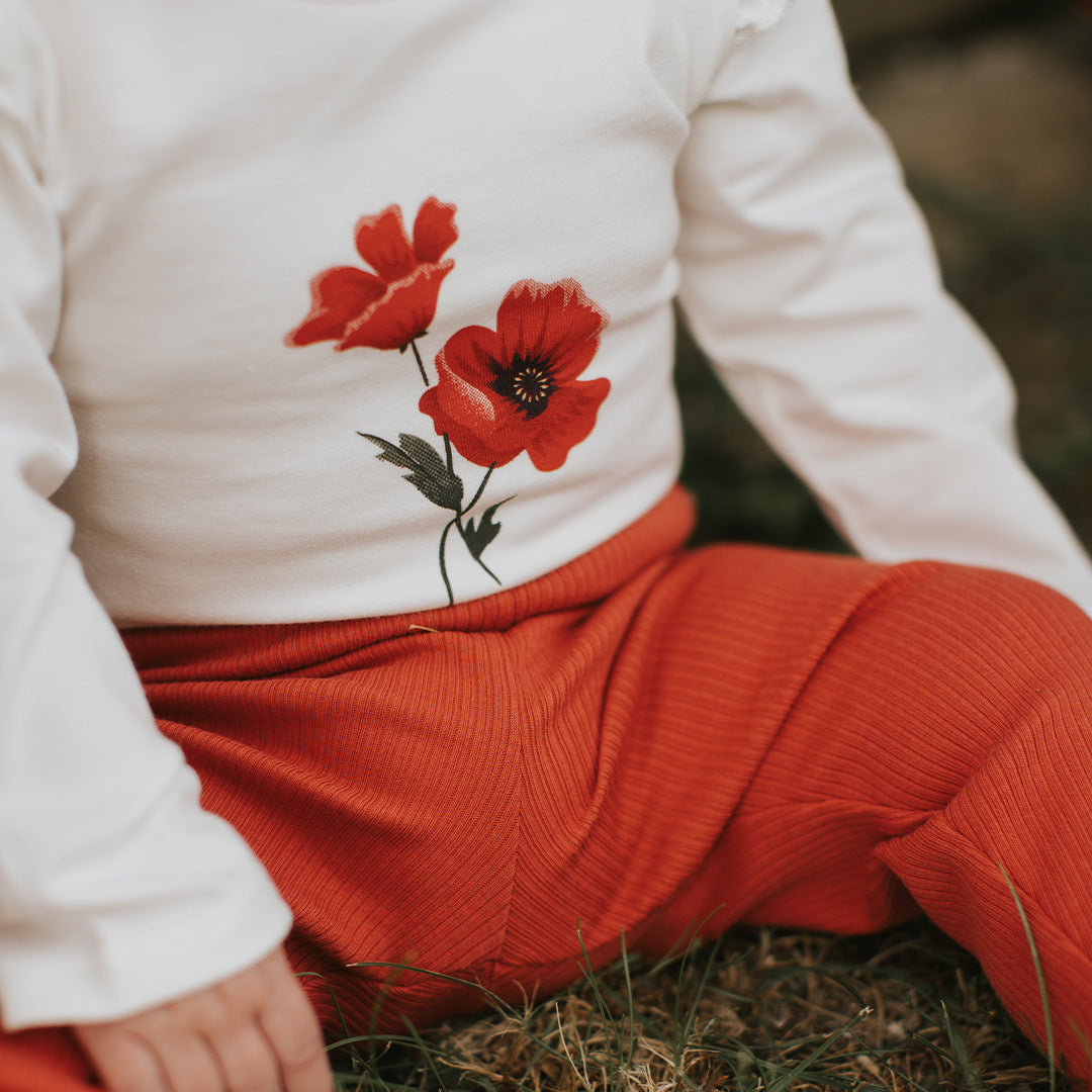 L/S White Ruffle Sleeve Bodysuit w/Poppy